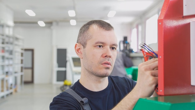 portrait electrician overalls is working with energy panel machinery equipment plant 274719 4290